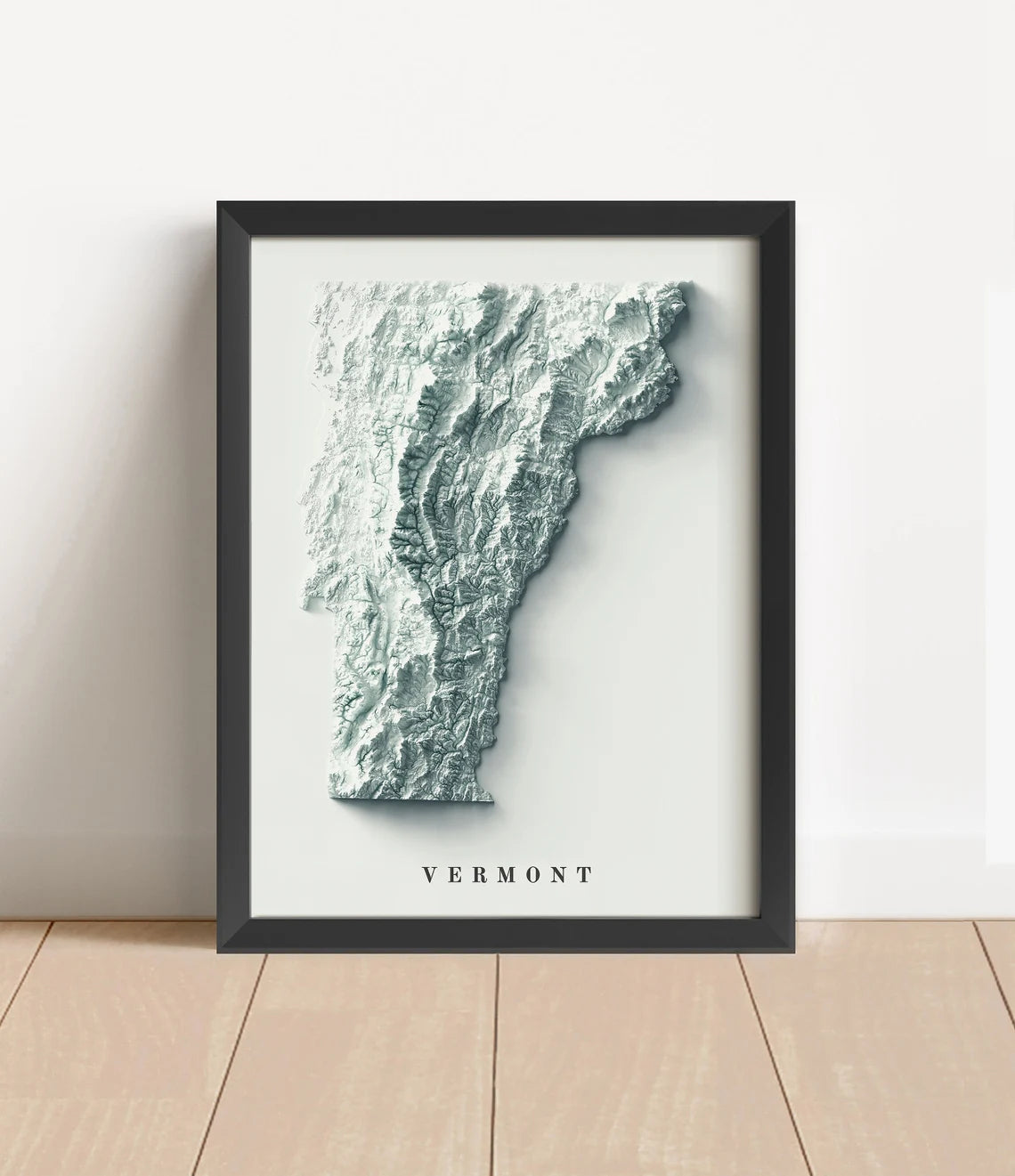 Vermont shaded relief map in black frame. Artistic print with realistic terrain effect for wall decor