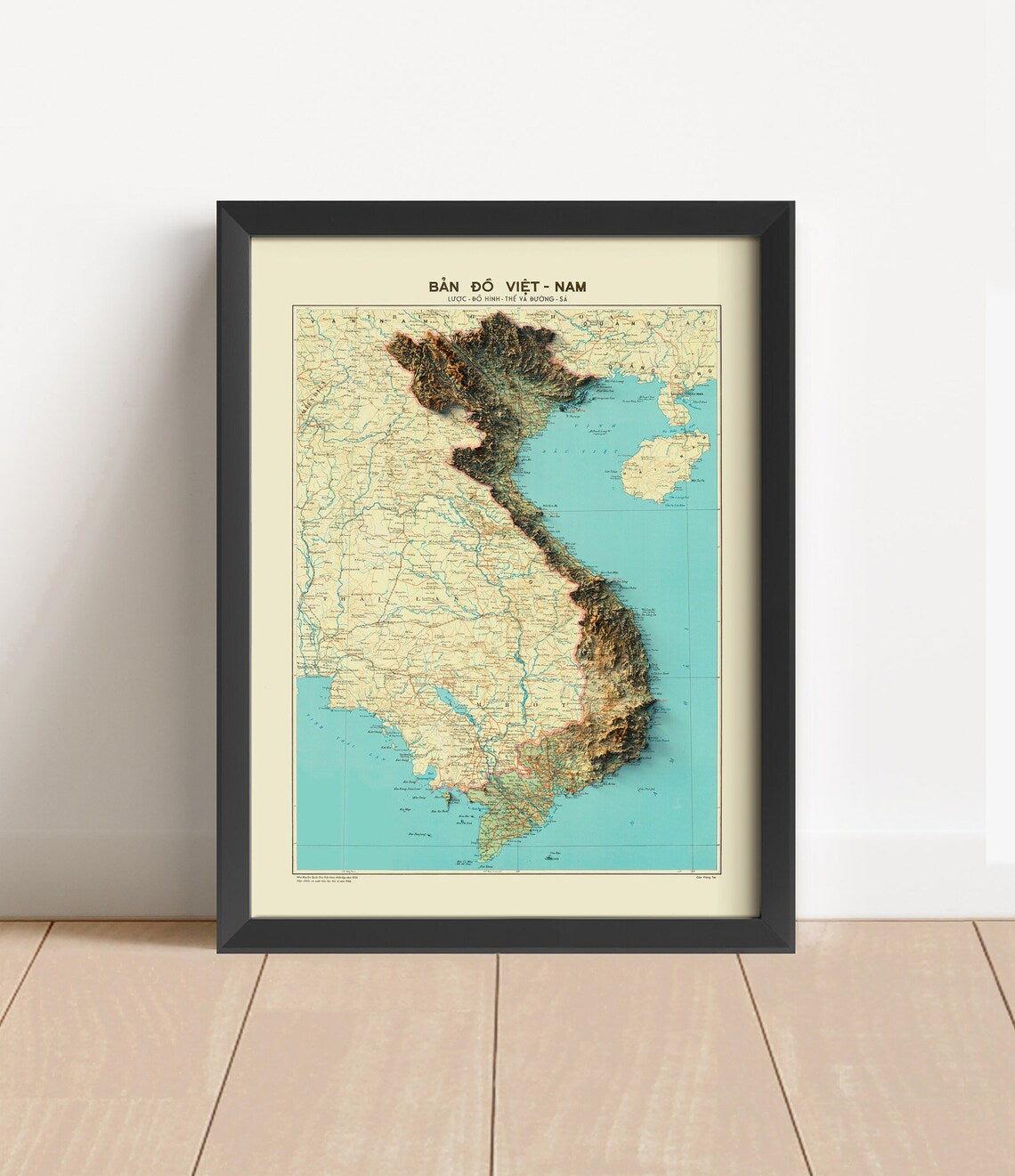 Vintage Vietnam shaded relief map in black frame. Artistic print with realistic terrain effect for wall decor
