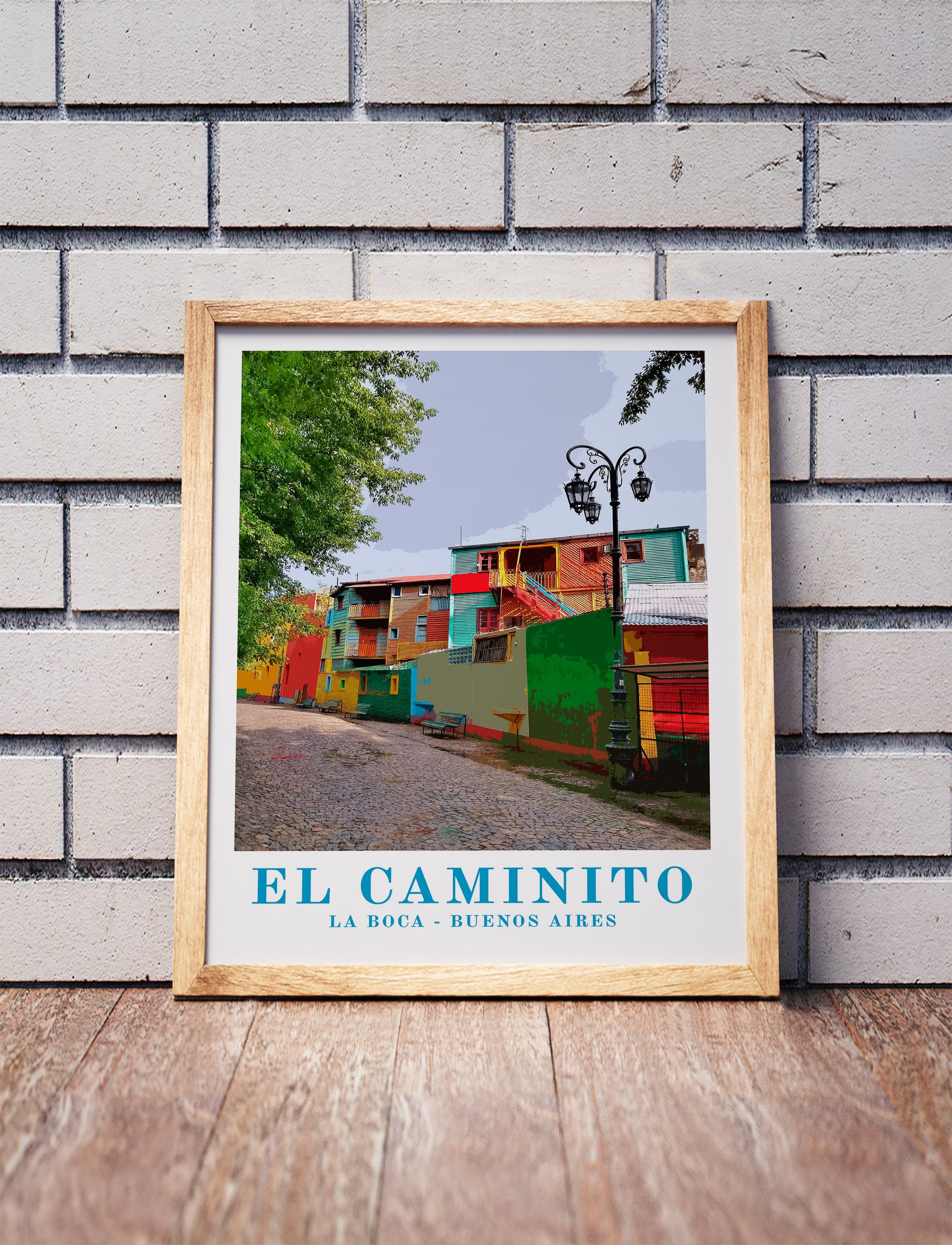 Vintage El Caminito, Buenos Aires, shaded relief map in a wooden frame. Realistic terrain art print for home decor, displayed against a brick wall