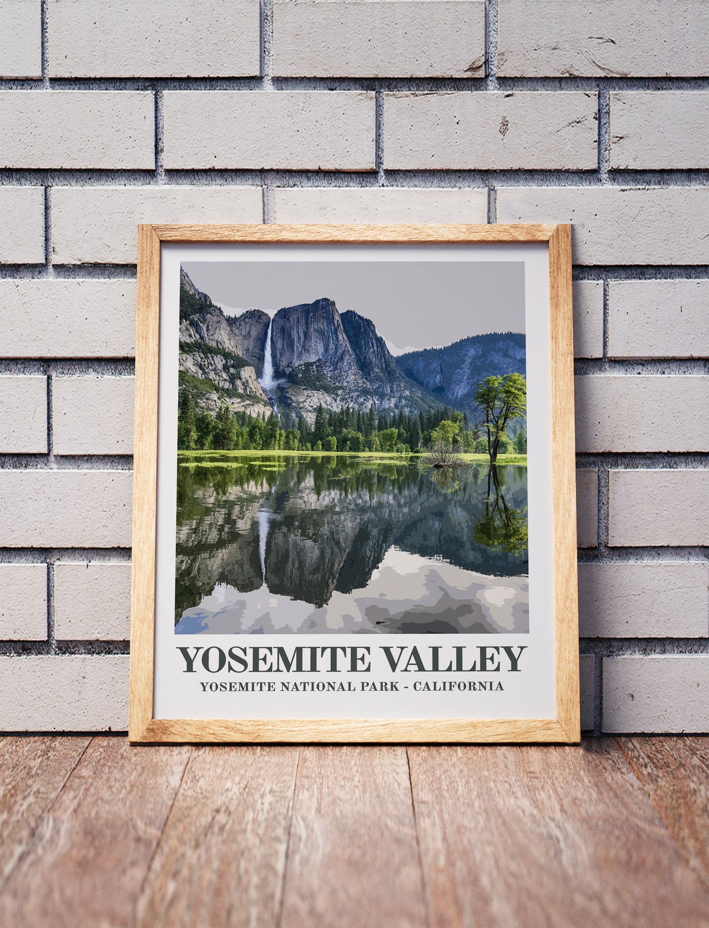 Yosemite poster in a wooden frame. Realistic terrain art print for home decor, displayed against a brick wall