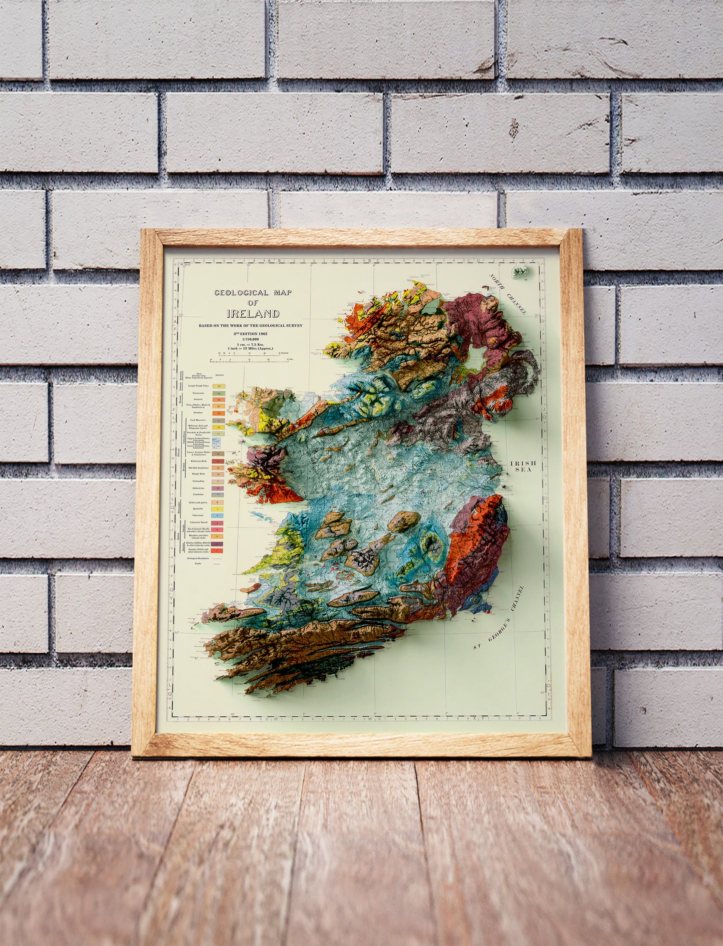 Vintage Ireland shaded relief map in a wooden frame. Realistic terrain art print for home decor, displayed against a brick wall