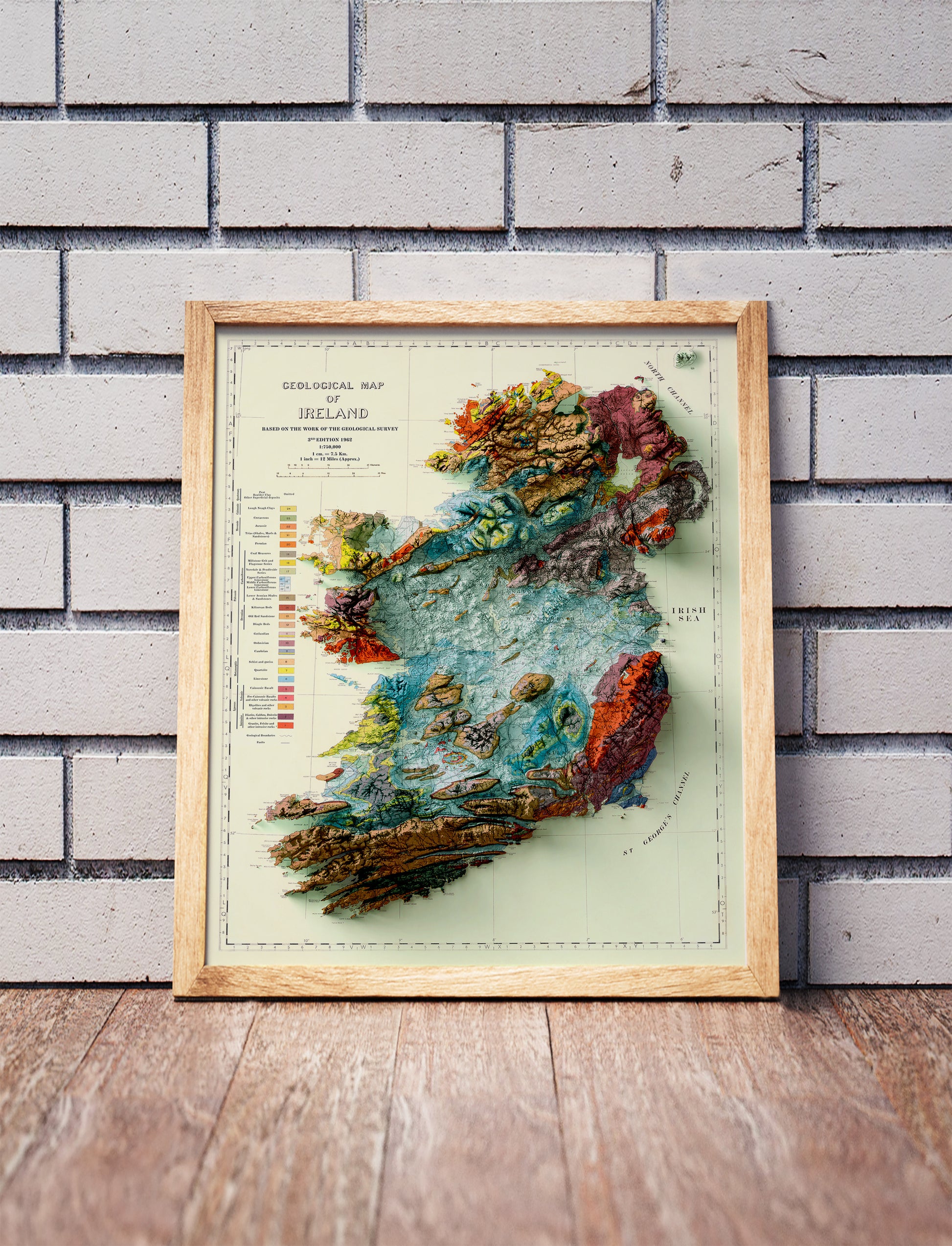 Vintage Ireland shaded relief map in a wooden frame. Realistic terrain art print for home decor, displayed against a brick wall