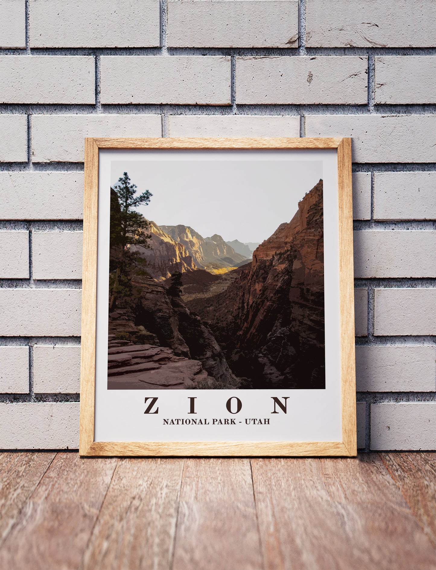 Zion National Park poster in a wooden frame. Realistic terrain art print for home decor, displayed against a brick wall